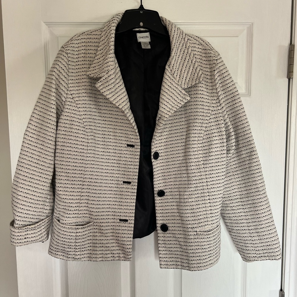 Cream and black colored Chico’s jacket. Lined. Size 3.